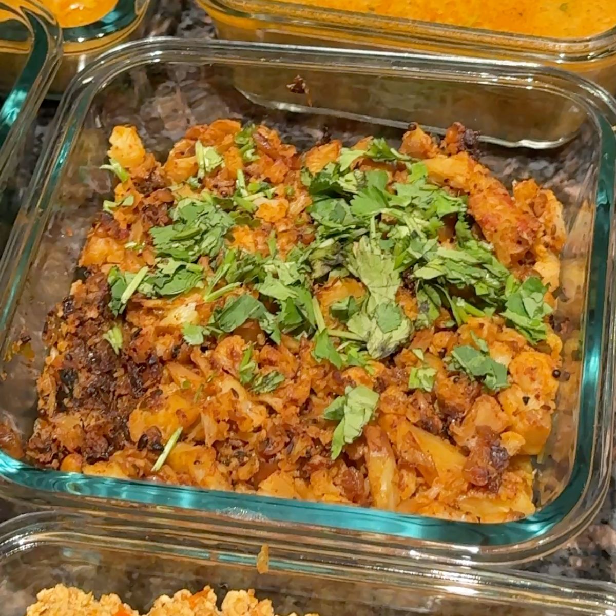 Spicy and flavorful Cauliflower Vepudu Fry served in a bowl, ready to pair with rice or rotis.