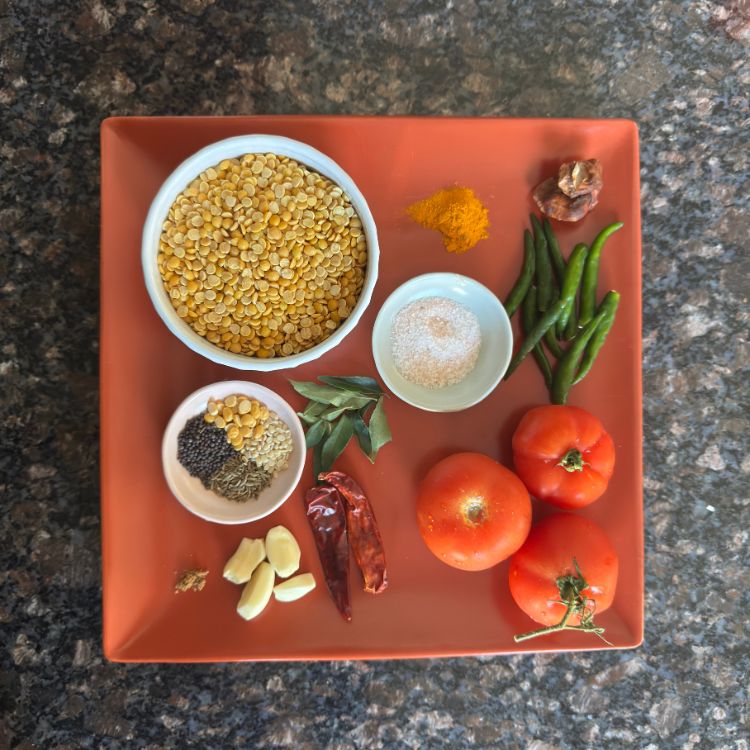 Ingredients for Tomato Pappu Dal in a plate