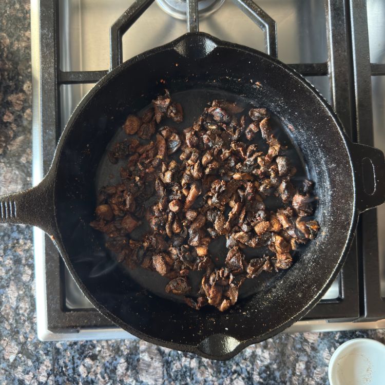 Perfectly cooked Indian spicy mushroom fry with aromatic spices in cooking pan