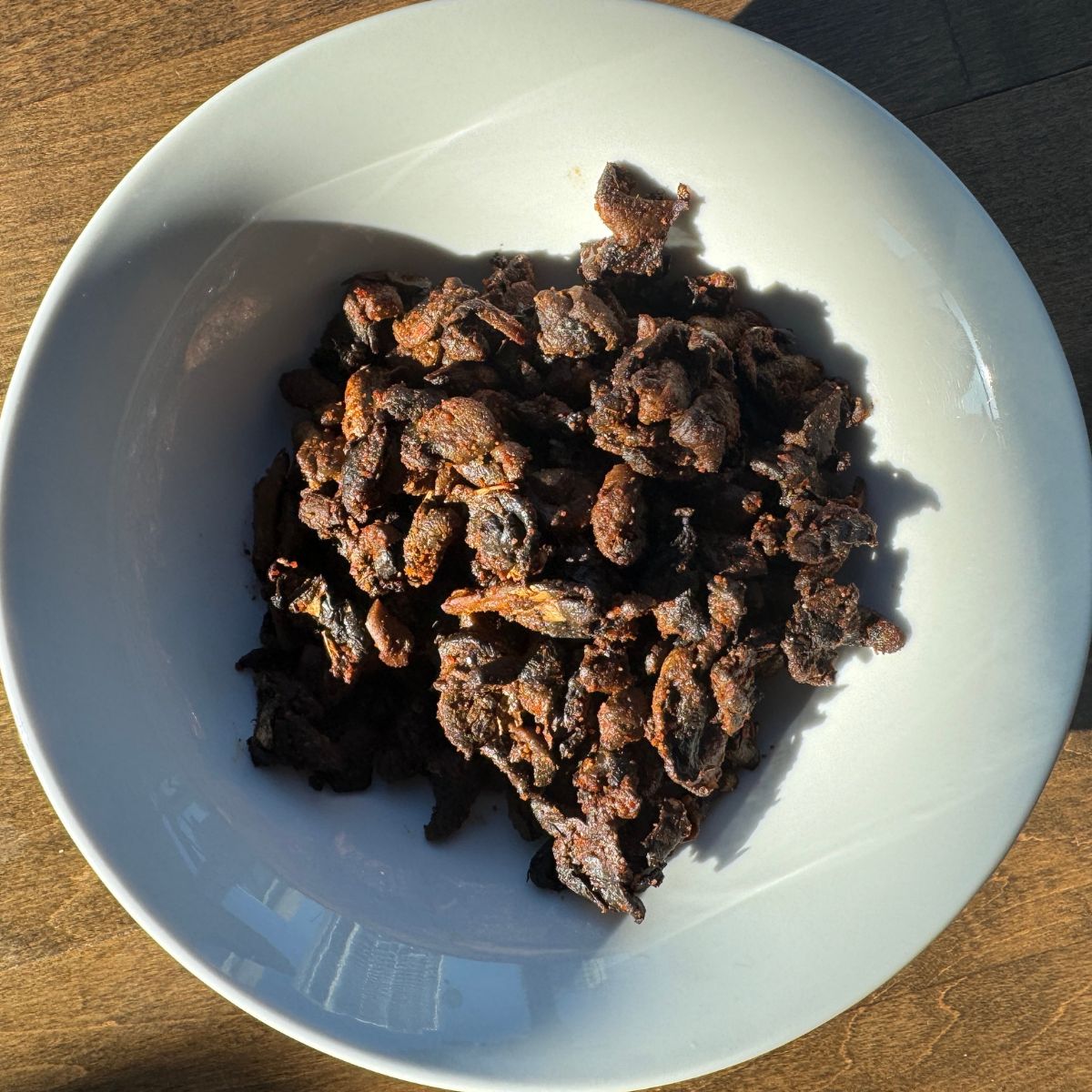 Hot and spicy Indian style mushroom fry served in a traditional bowl, ready to eat