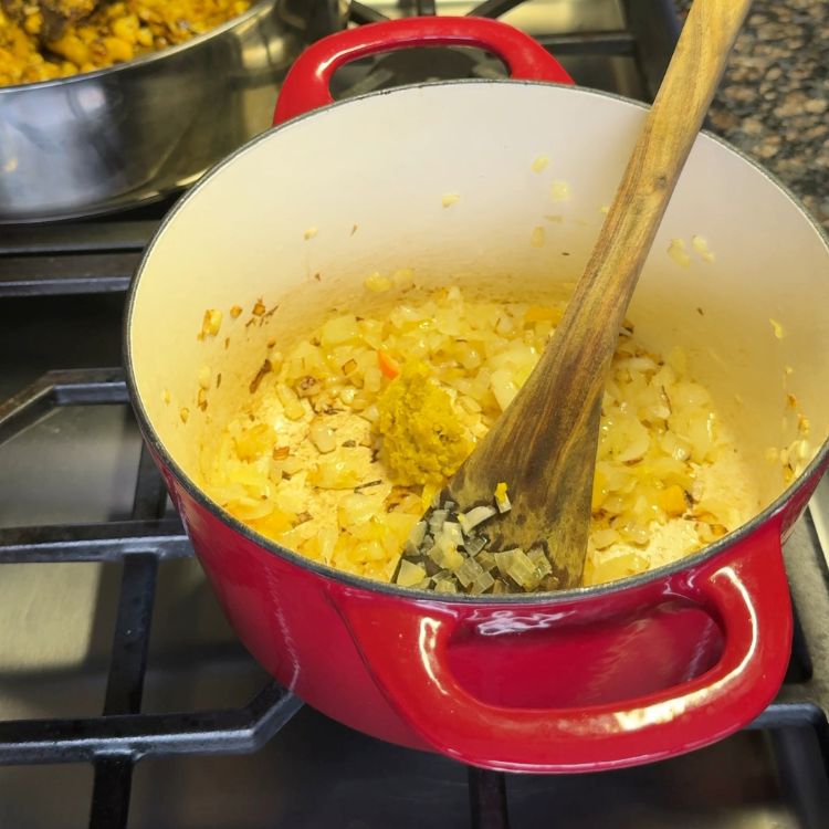 Sauteing ginger garlic paste until smell is gone for spicy Tofu Burji